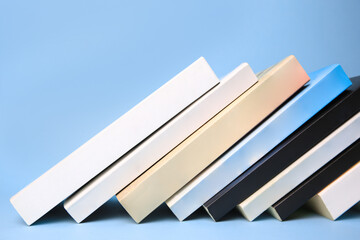 Collection of books on light blue background