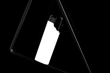Stylish presentation of small pocket lighter on black background