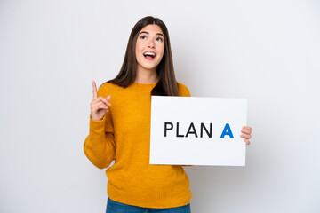 Young Brazilian woman isolated on white background holding a placard with the message PLAN A and thinking