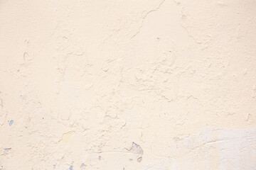 Beige background of the plastered wall. Close up.