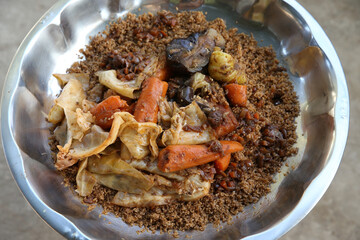Thieboudienne or chebu jen: traditional national dish of Senegalese cuisine. Plate with...