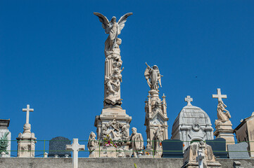 Stone statues in an ancient cemetery, Gothic figures in a crypt