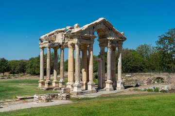 Fototapeta na wymiar Tetrapylon, monumental gate of Aphrodisias in Karacasu, Aydin, Turkey. The monumental columnar entrance to the sanctuary of Aphrodite. 