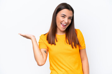 Young caucasian woman isolated on white background holding copyspace imaginary on the palm to...