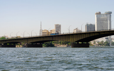 bridge over the river Nile and high houses in Cairo