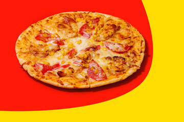 Pizza on a cream base with tomatoes, corn and mozzarella cheese