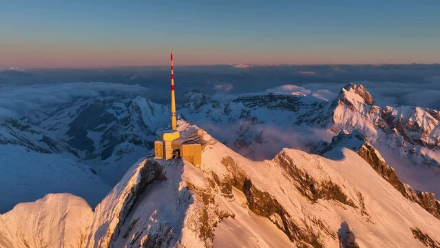 Aerial View of the Mountain Seantis in the Swiss Alps, Switzerland. Santis Weather Station, View Platform at sunset.