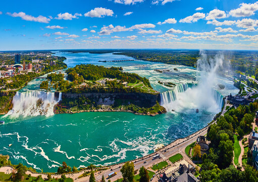 Wide panorama of entire Niagara Falls from Canada overlook - Powered by Adobe