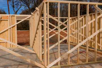 Fototapeta premium Building construction wood framing beams of a new house under construction
