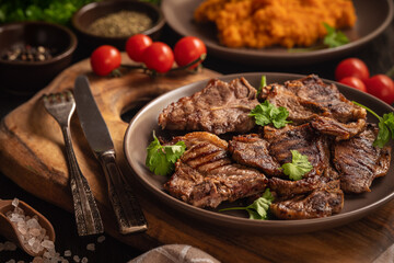 Grilled lamb cutlets served with mashed sweet potatoes.