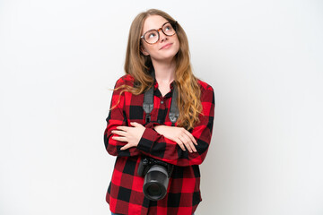 Naklejka premium Young photographer pretty woman isolated on white background looking up while smiling