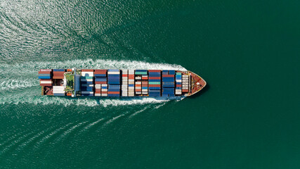 cargo logistics container ship sailing in green sea to import export goods and distributing products to dealer and consumers across worldwide, by container ship Transport business service.