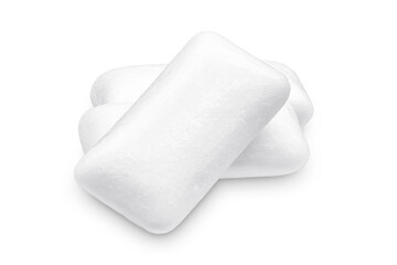 Three pieces of white chewing gum isolated on white. The whole subject is in focus.