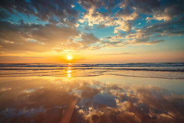 Beautiful sunrise over exotic tropical sea sand and beach shore