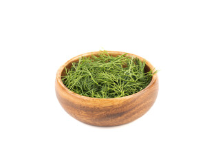 Wooden bowl with fresh dill isolated on white background.