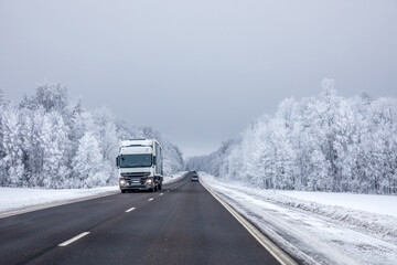 Obraz na płótnie Canvas Truck on winter country road