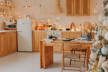 Christmas Kitchen. Preparations for family dinner, home recipes, cooking chocolate cake. beige golden background. Simple home interior