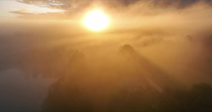 Foggy sunrise at latvian lake