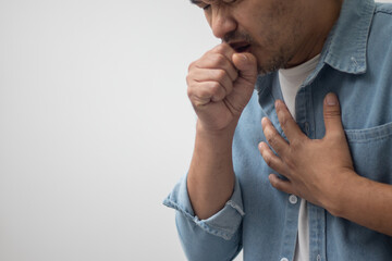 man wearing white shirt coughing on white background