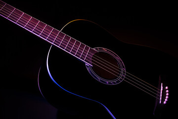 Fototapeta na wymiar black guitar split colored concept. guitar music dark shoot