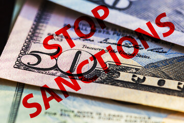 Banknotes of the American dollars with inscriptions stop sanctions