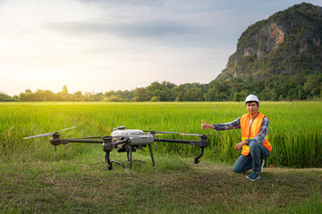 Naklejka na ściany i meble Agricultural specialist and agriculture drone. Agriculture 5g, Smart farming, Smart technology concept.