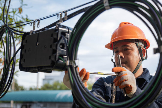 Technician are checking fiber optic cable for maintenance.
