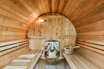 Wooden sauna with tube-shaped seats