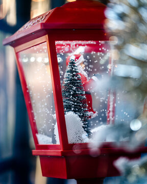 red Christmas lantern with a tree inside