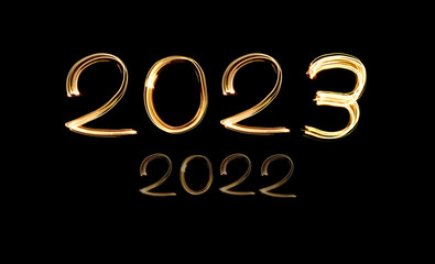 2023 written with shiny lights. New year 2023 concept photo. Light painting.