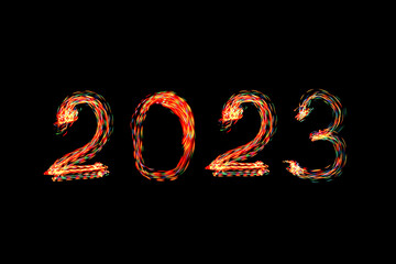 2023 written with shiny lights. New year 2023 concept photo. Light painting.