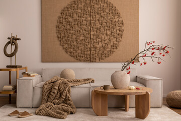Interior design of living room interior with mock up poster, beige sofa, modern armchair, braided...