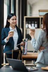 Group of Asian female lawyers discussing legal issues in conference room, advice and justice concept.