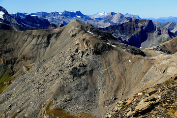 Panoramic view of the landscape with mountains in the foreground against a gradient blue sky on Mount Schilthorn, near Lauterbrunnen and Interlaken in Switzerland