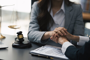 Group of Asian female lawyers discussing legal issues in conference room, advice and justice concept.