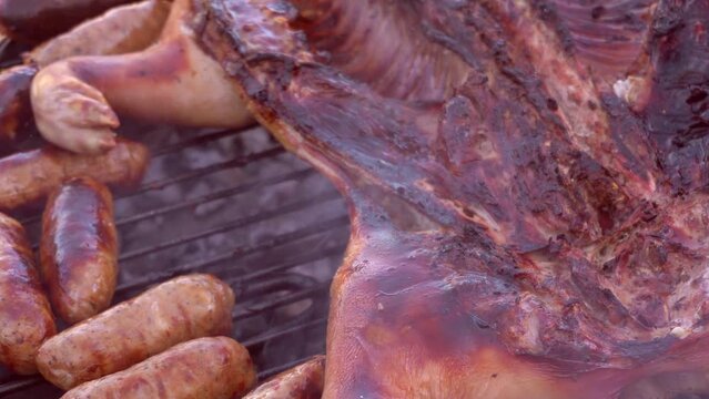 grilled pork on low heat with homemade sausages