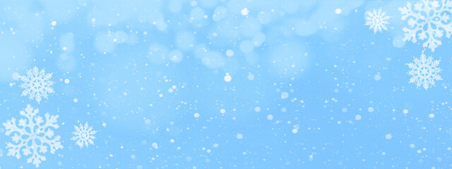 snowflakes and ice crystals isolated on blue sky - winter background panorama banner long..