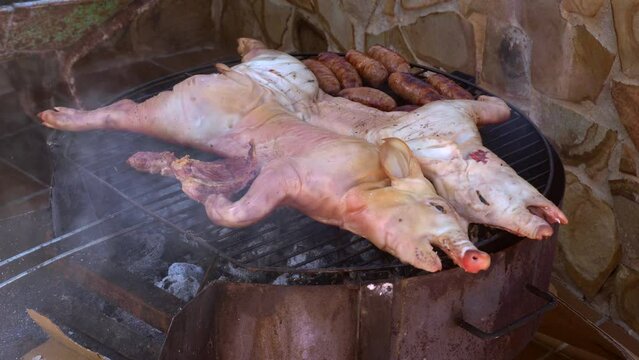 grilled pork on low heat with homemade sausages