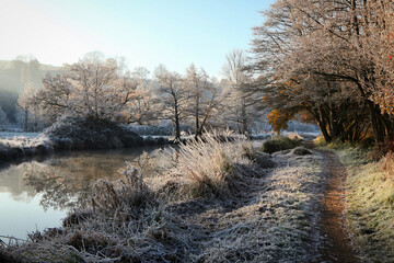 Winter reflections on the river Wey on a cold and frosty day.