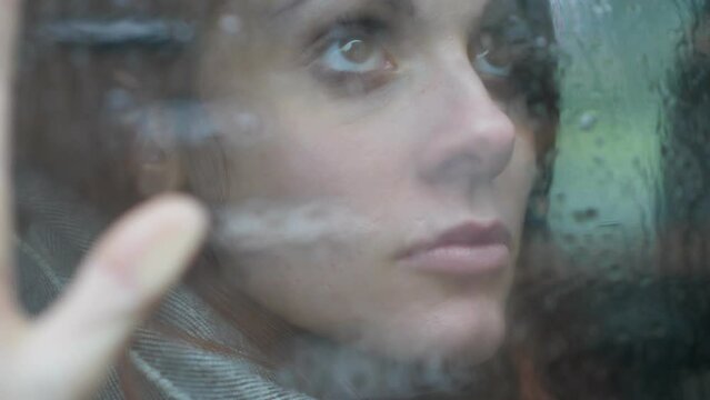 depressed woman locked alone in the car looks up thinking