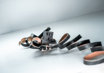 There is black leather tefillin on the table. Jewish traditions and religion (114)