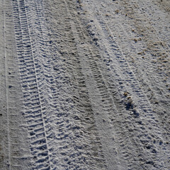 Car tire pattern in snow.