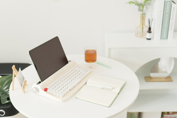 flat lay working accessory with retro keyboard book and pen on white table background