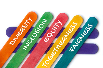 Diversity, inclusion, equality, togetherness and fairness text on colorful wooden stick. Business...