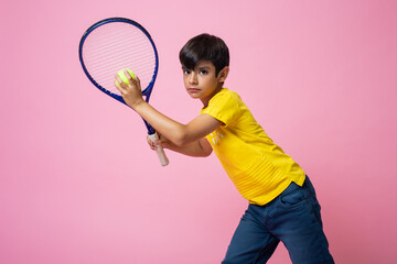 Portrait of a caucasian boy playing tennis
