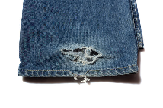 Broken Blue Jeans Hem On White Background