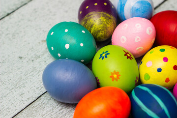 Fototapeta na wymiar Colorful collection of patterned easter eggs on wooden table