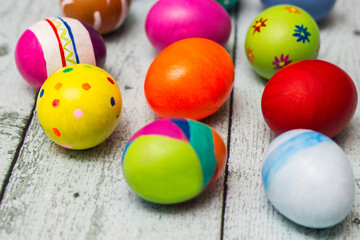Colorful collection of patterned easter eggs on wooden table