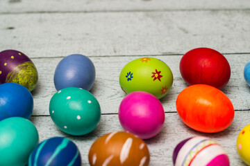 Colorful collection of patterned easter eggs on wooden table