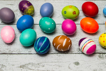 Colorful collection of patterned easter eggs on wooden table
